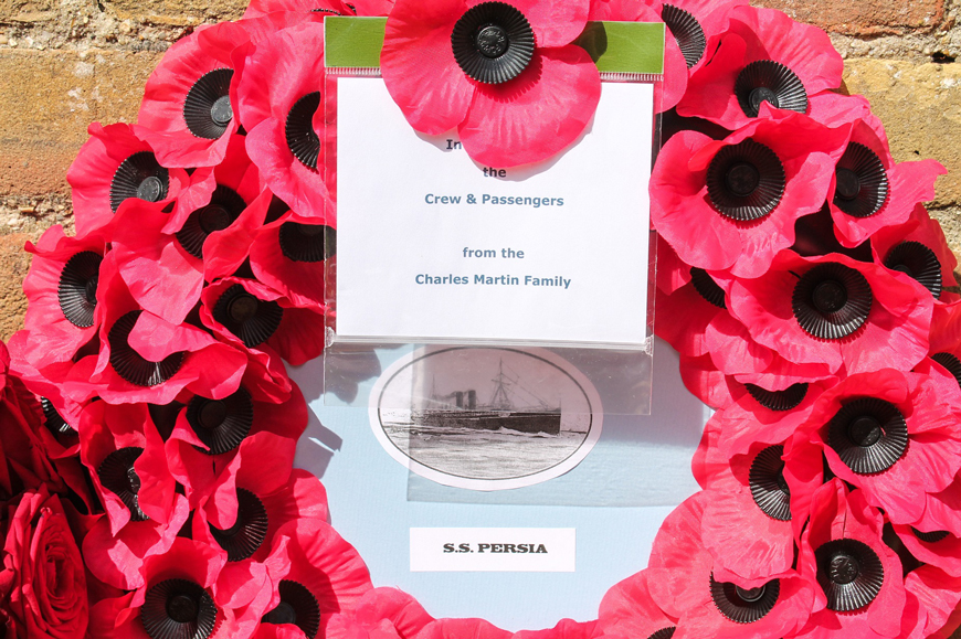 Wreaths and flowers laid by relatives at first memorial for 343 victims of the sinking of SS Persia